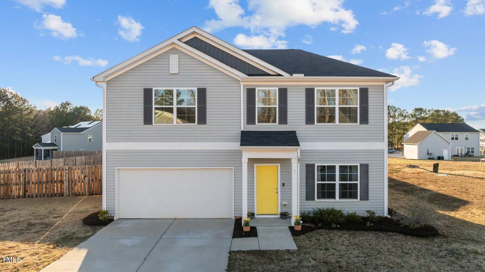 A house with a yellow door.