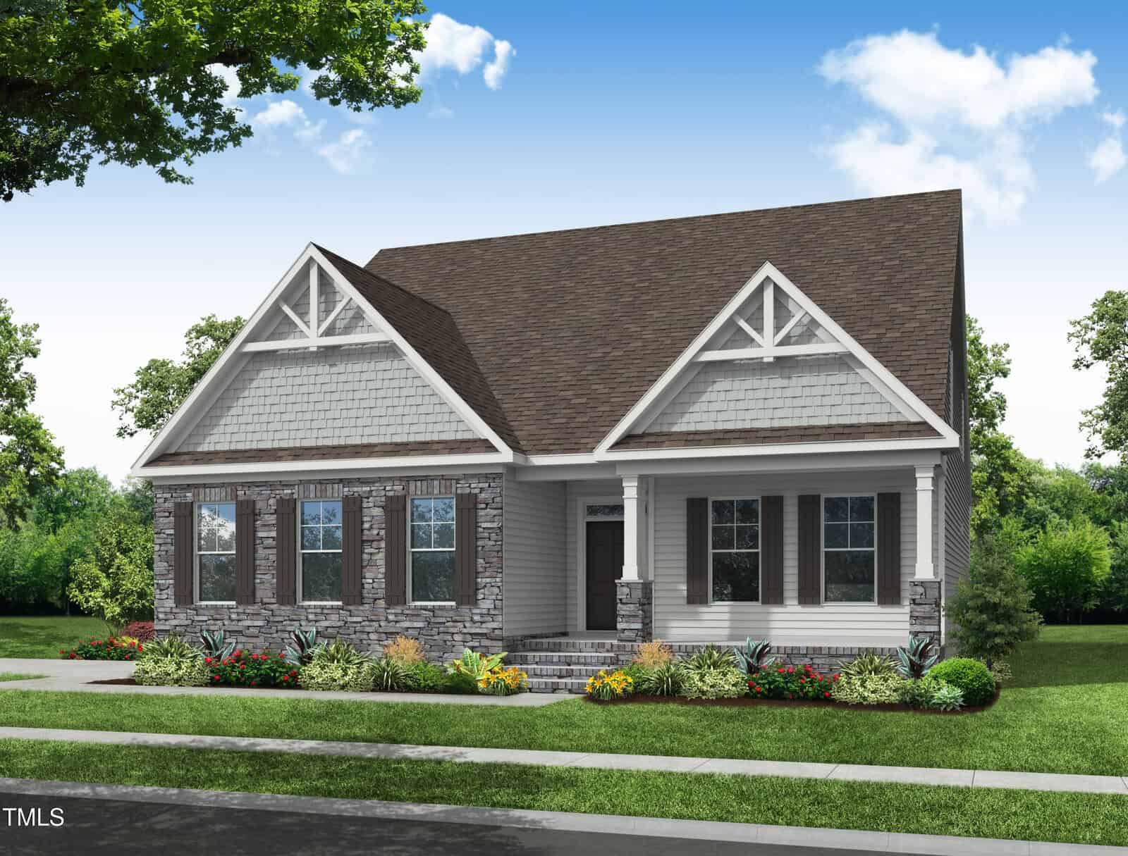 A single-story house with gray stone and light siding exterior, brown gabled roof, white trim, front porch, and landscaped garden beds, set against a clear blue sky with trees in the background.