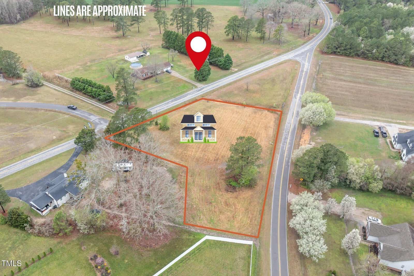 Aerial view of a house in a fenced, triangular lot bordered by roads. Nearby properties and trees are visible. White text and a red location marker highlight the property. The phrase “LINES ARE APPROXIMATE” is shown.