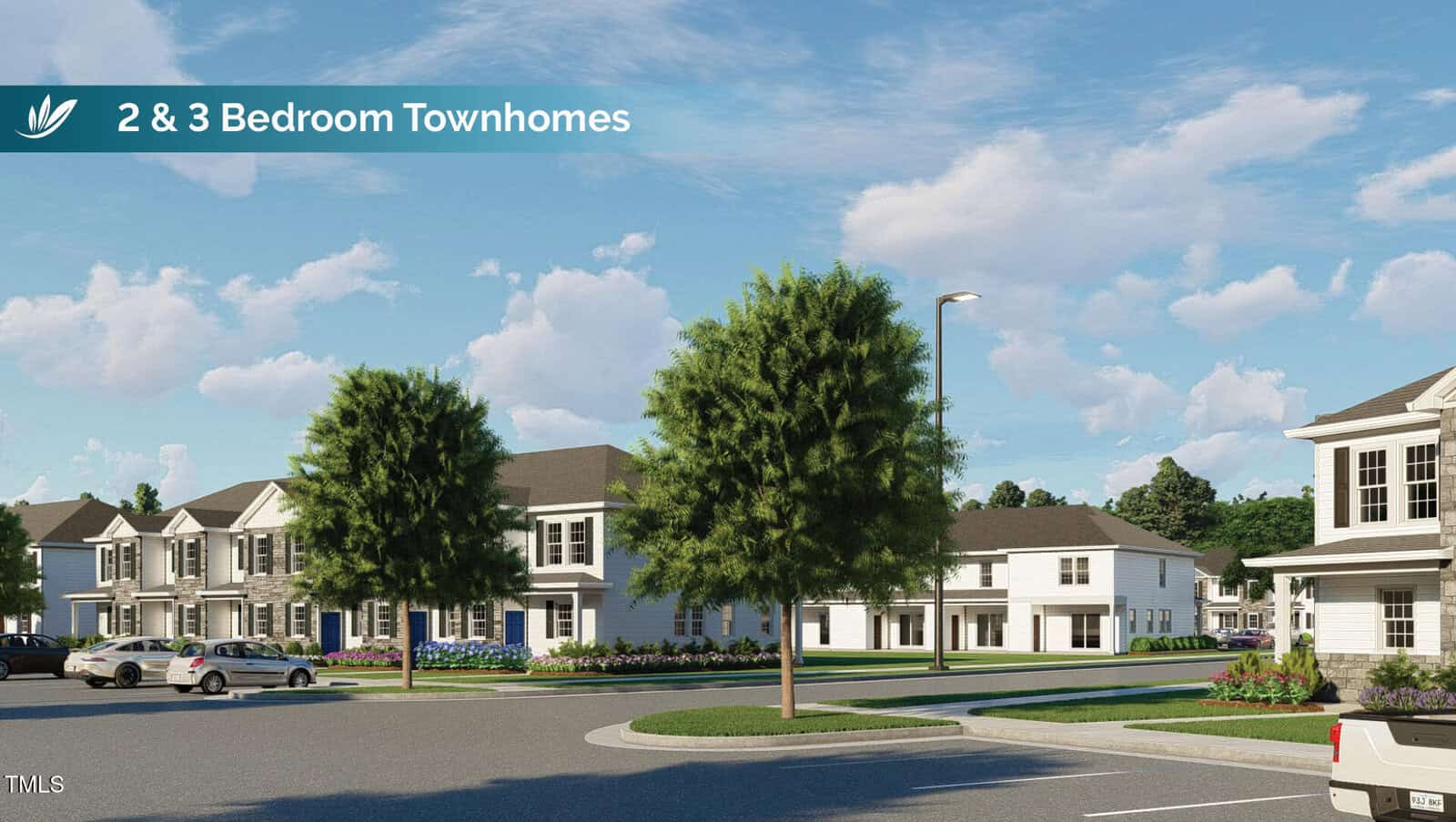 Nestled in a serene residential area, the two-story townhomes of 1101 Brookrun Road boast similar architectural styles under a sunny Oxford sky. A street lined with trees and a grassy median offers charm, while signs point to available 2 and 3-bedroom options amidst a few parked cars.