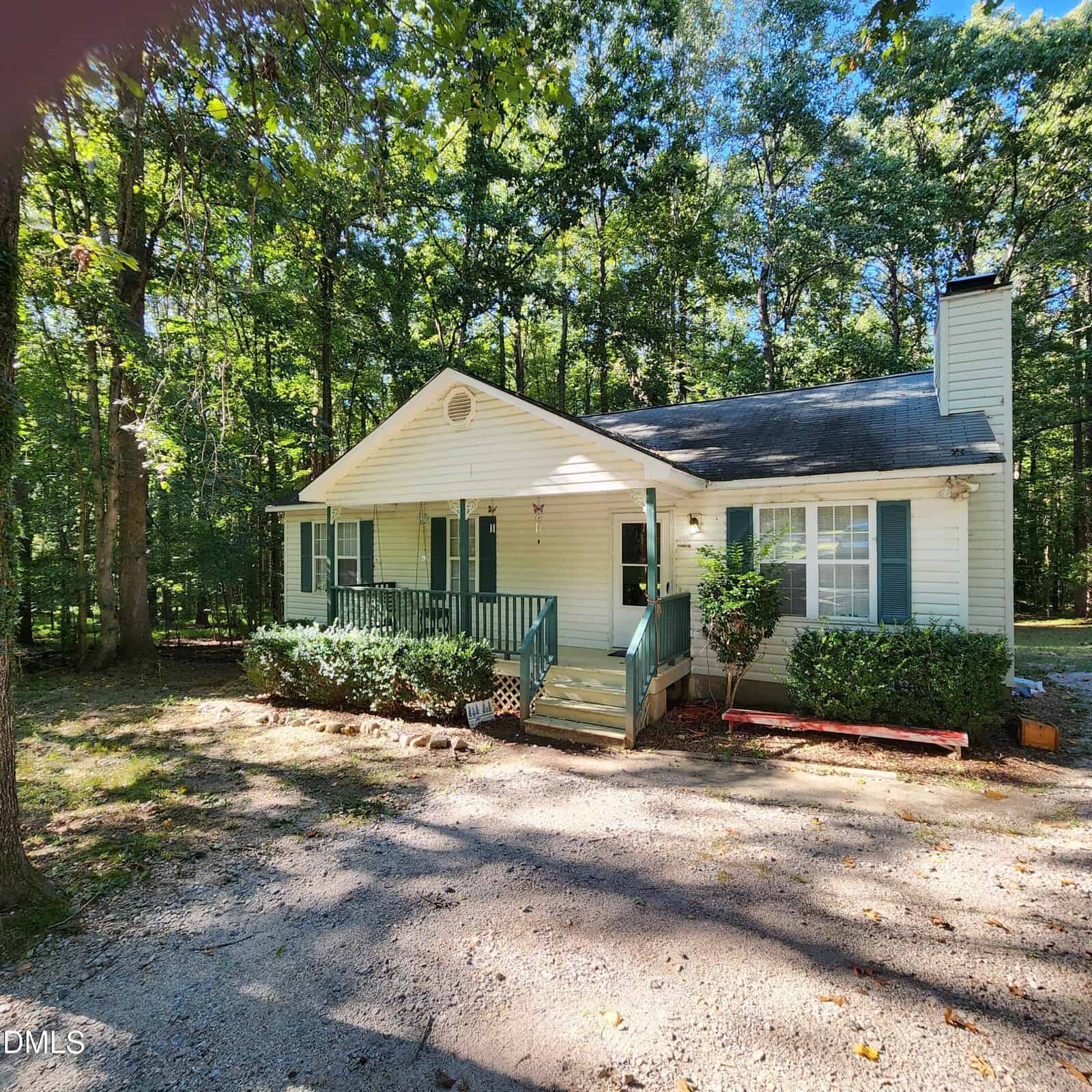 A charming house at 132 Waiters Way, Youngsville, with beautiful trees in the background.