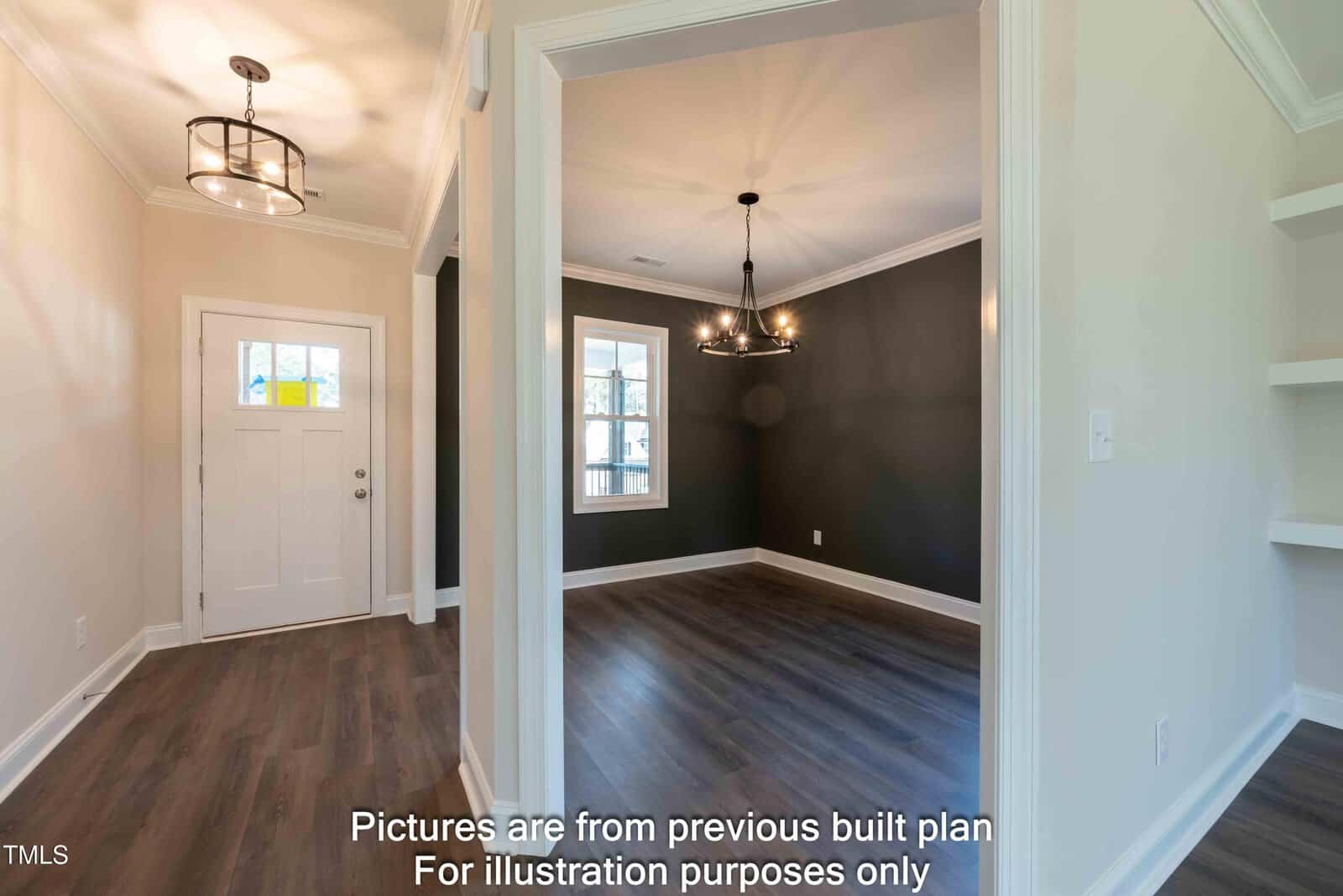 A view of a modern entryway and dining room with dark hardwood floors, white walls, a black accent wall, and contemporary light fixtures. A window allows natural light into the space. Text is overlaid at the bottom of the image.