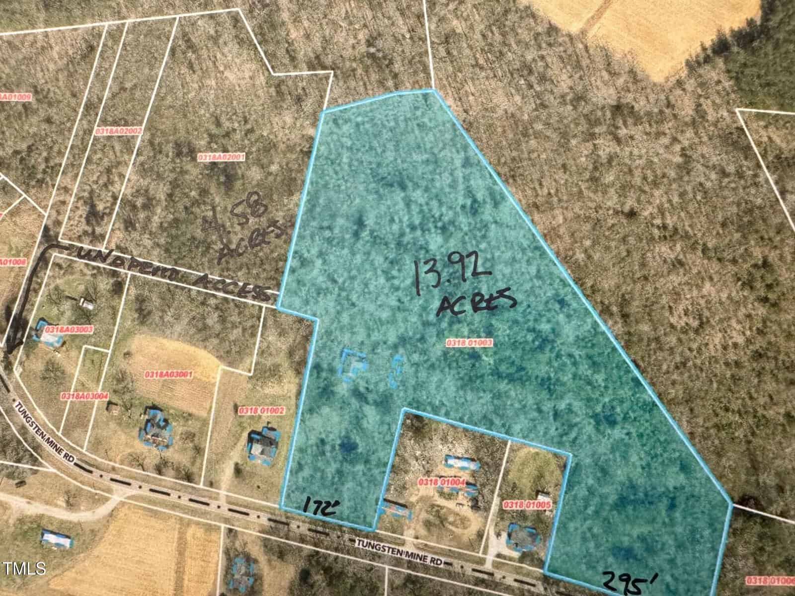 A map showing a large, outlined plot of land labeled "13.92 acres," surrounded by smaller parcels. The plot has a wooded appearance and is adjacent to Tungsten Mine Road. Nearby parcels are labeled with different numbers.