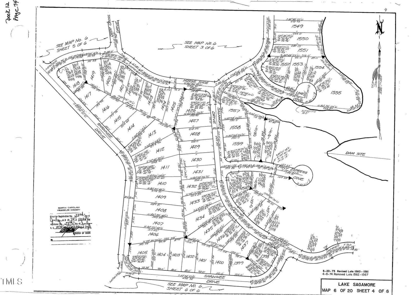 A black and white map showing numbered plots in a residential area labeled "Lake Sagamore." Roads, property boundaries, and water features are marked, with annotations and arrows throughout. North is indicated in the upper right corner.