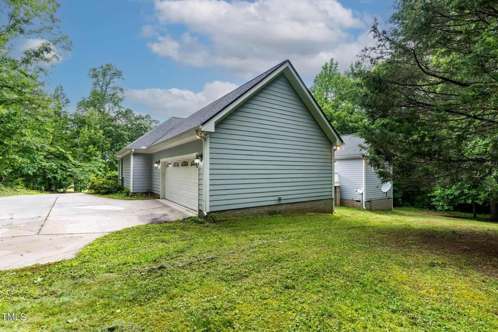 A house with a garage and a driveway.