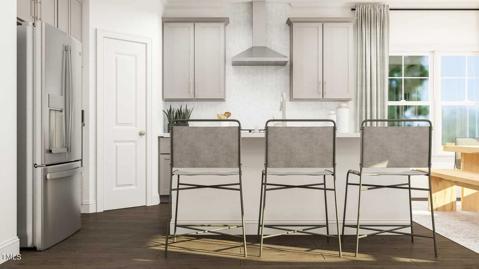 Modern kitchen with light gray cabinets, stainless steel appliances, a central island with three backless barstools, a potted plant, and a dining table near a large window with light curtains.
