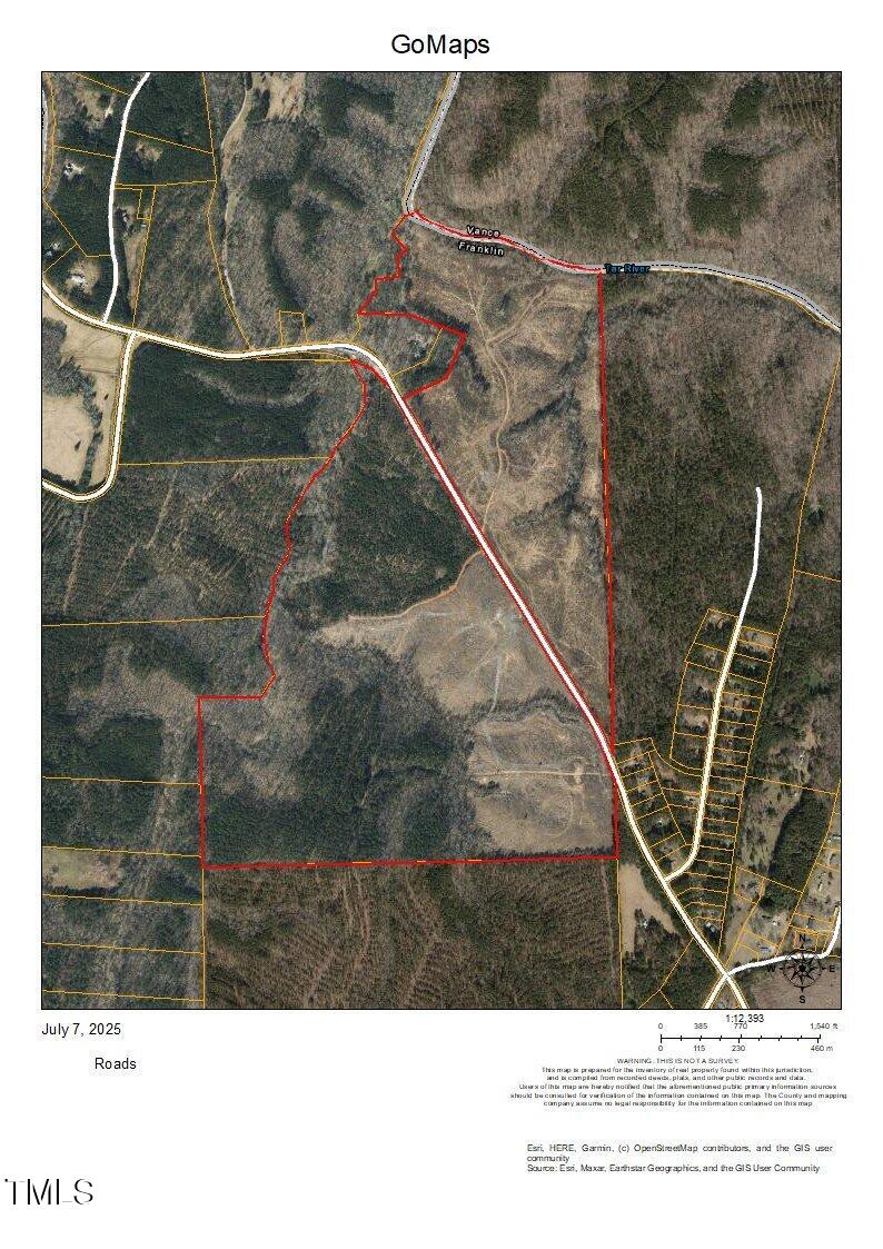 A satellite map shows a large wooded area outlined in red, intersected by a white road. Additional roads and buildings appear in the bottom right; the surrounding land is mostly forest. Dated July 7, 2025, labeled GoMaps.