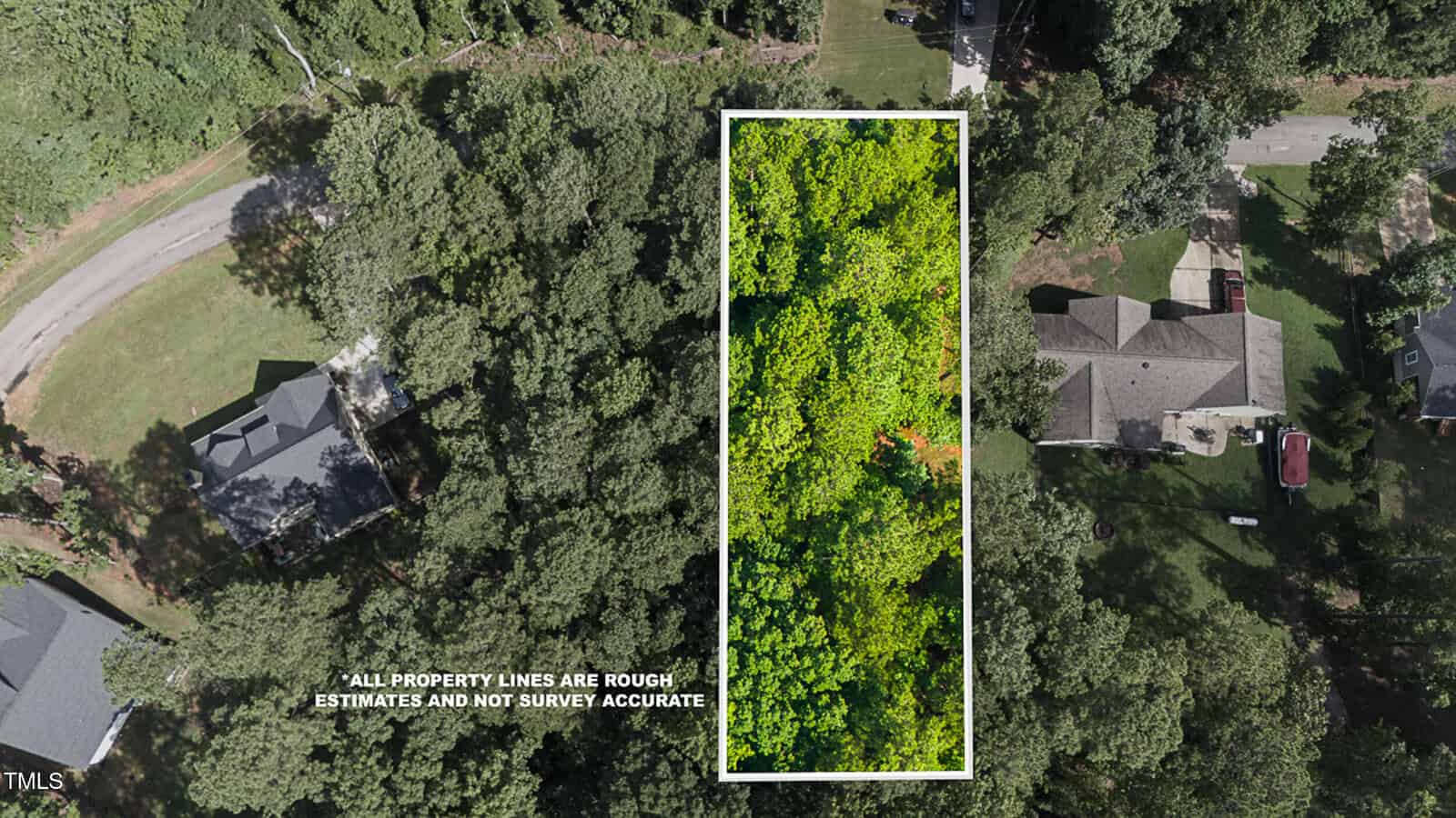 Aerial view of a rectangular wooded lot outlined in white, surrounded by houses and roads. Text notes that property lines are rough estimates and not survey accurate.