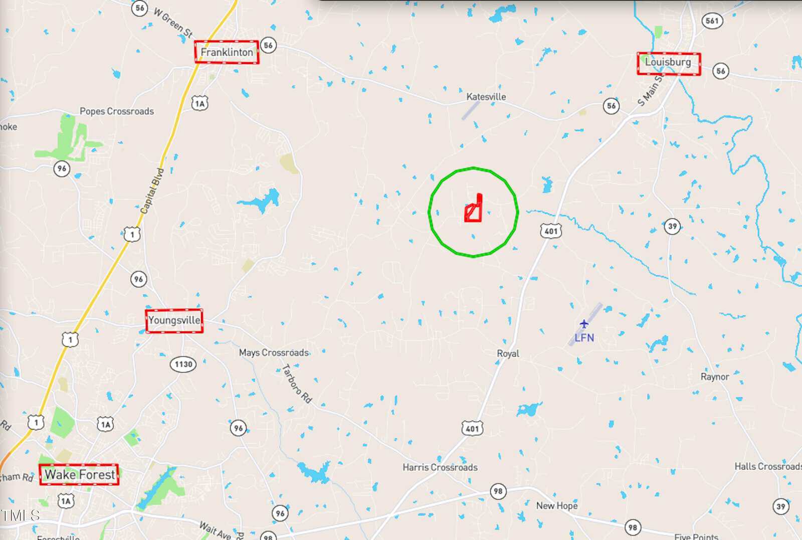A map showing the area between Wake Forest, Youngsville, Franklinton, and Louisburg, North Carolina, with a green circle and red symbol marking a specific location near the center.