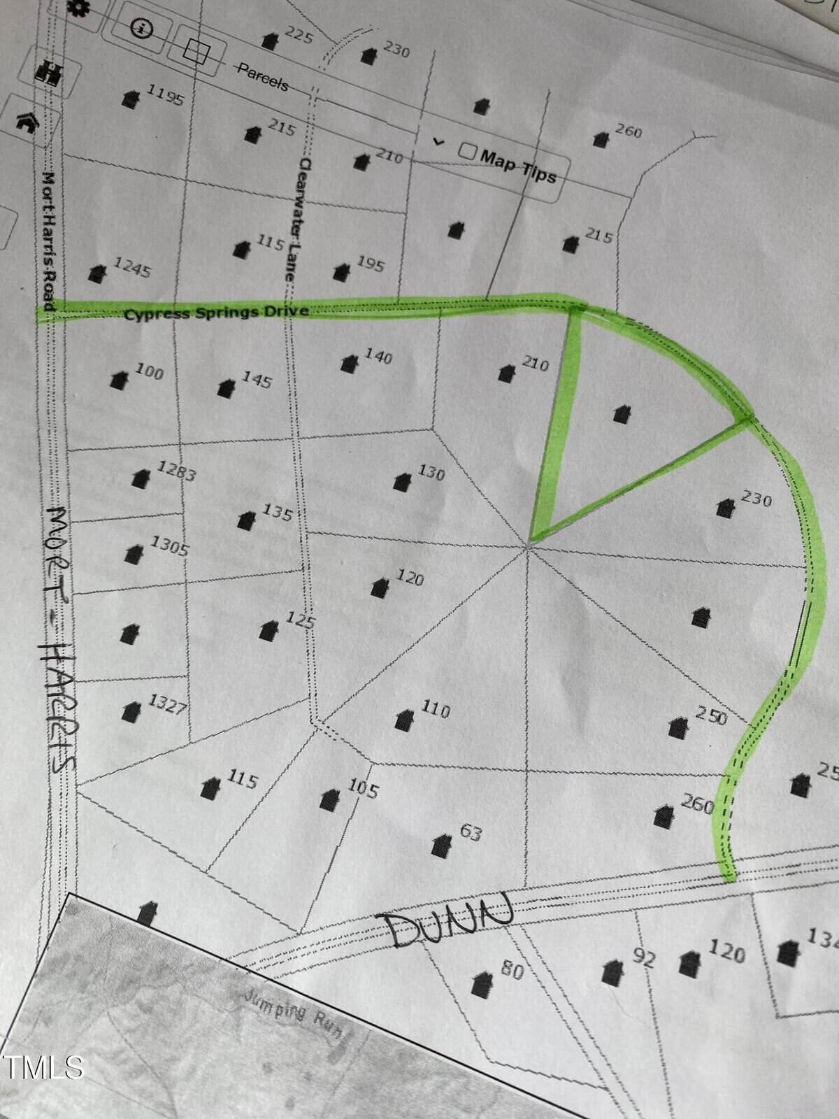 A black and white map showing lot numbers and house icons in a residential area. Cypress Springs Drive is highlighted in green, curving through the map. Dunn is written by hand near the bottom. Other street names and lot numbers are visible.