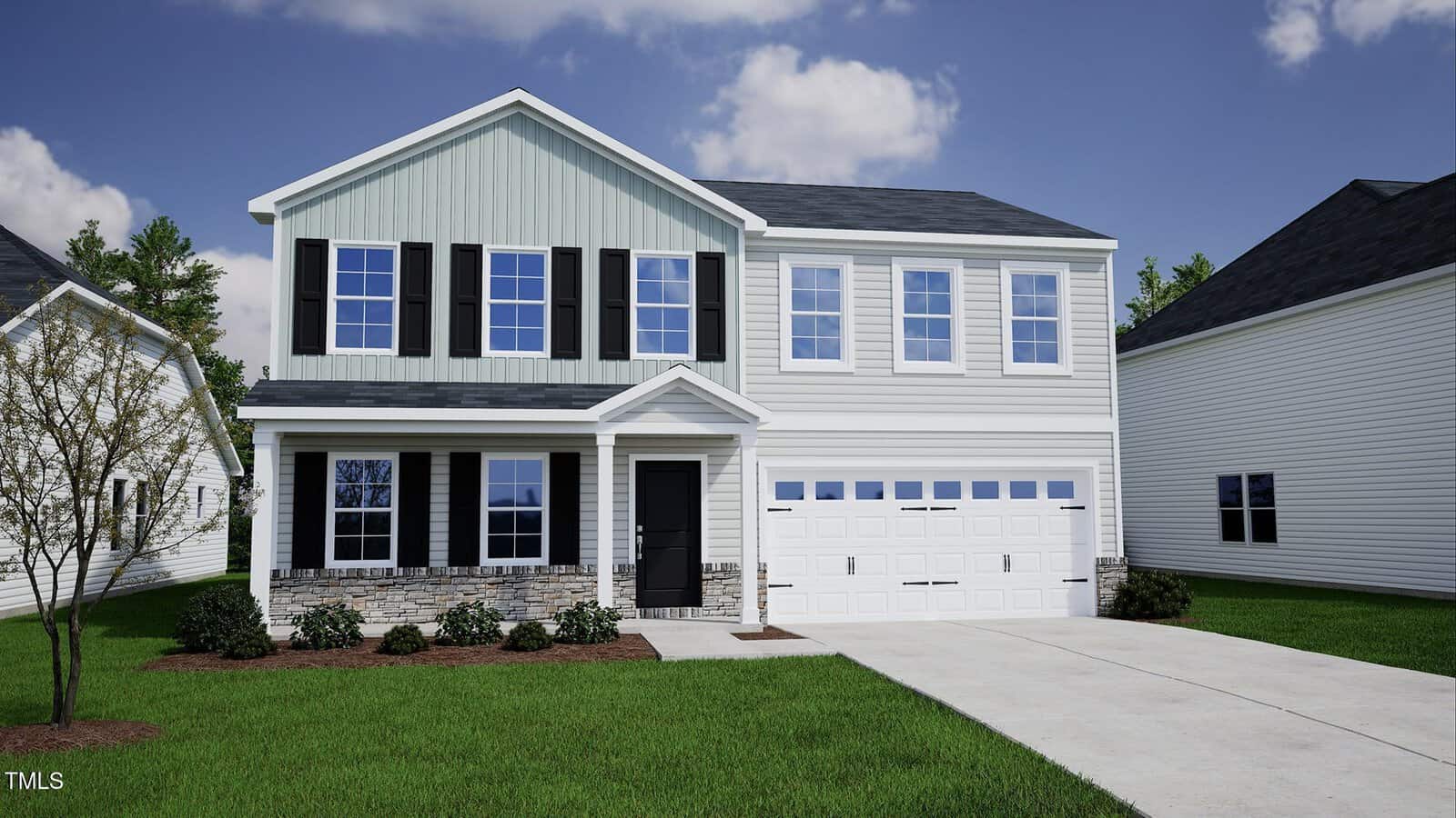 This charming two-story suburban house at 72 Plantation Drive, Youngsville, features light-colored siding, black shutters, a welcoming front porch, and a spacious two-car garage. The neatly trimmed lawn is accented by small bushes near the entrance, while the sky above is partly cloudy.