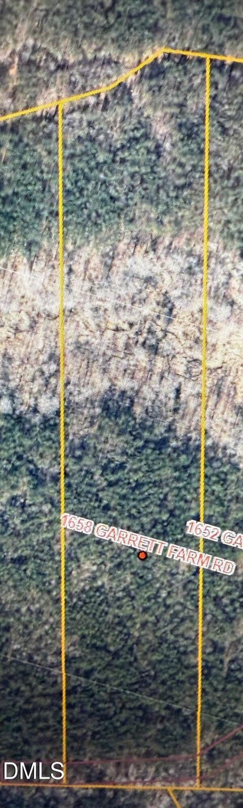 A satellite map view shows wooded land divided by yellow property lines in Stem, with "1658 Garrett Farm Road" marked in red on one section and "1657 GARRETT FARM RD" nearby. The DMLS watermark appears at the bottom left.