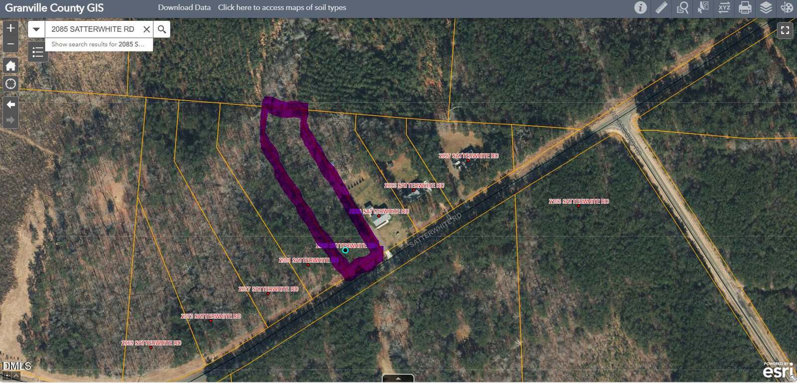 A satellite map from Granville County GIS shows a wooded area with property lines. One parcel is outlined in purple. Several labelled plots and intersecting roads are also visible.