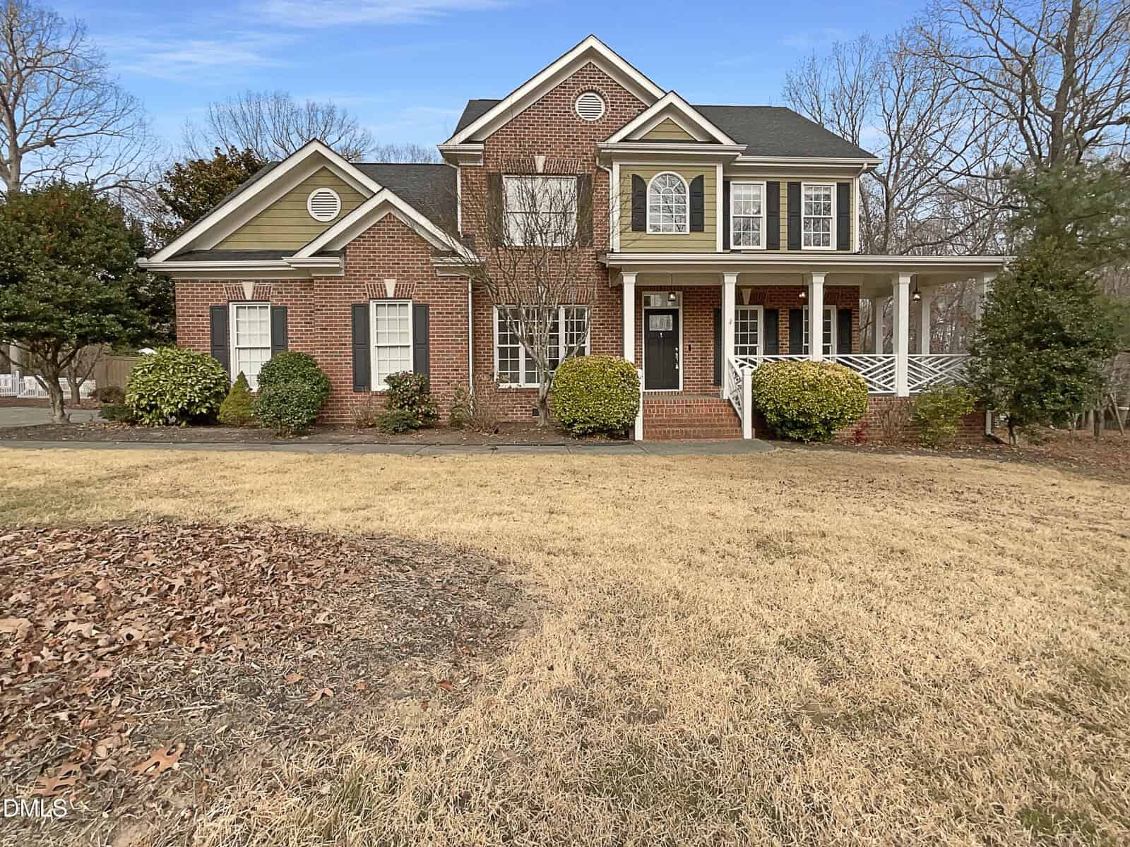 A large brick house with a lawn awaits you at 45 Georgetown Woods Drive in Youngsville.