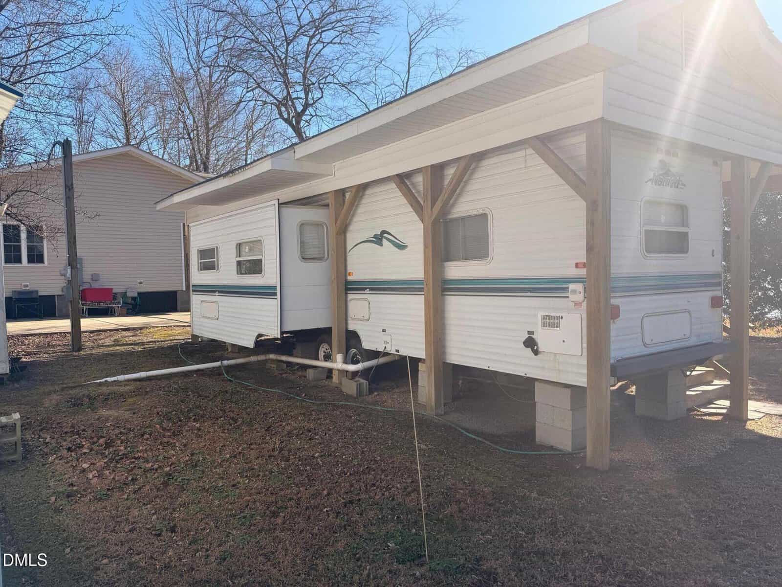 A trailer parked in a yard.