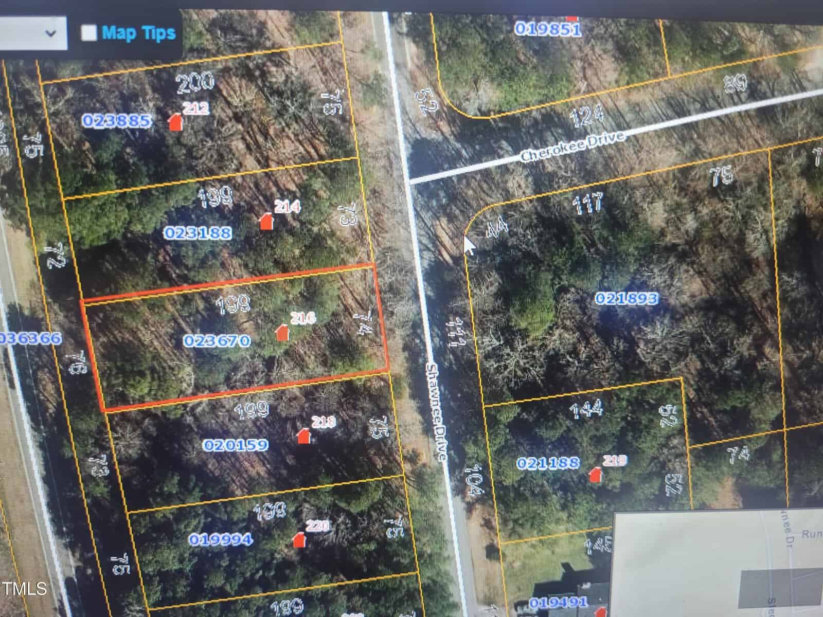 A digital map displays property boundaries and parcel numbers along Cheston Drive, Stephenson Road, and 216 Shawnee Drive in Louisburg. Several lots are outlined in yellow, with red icons and white numbering designating property details. Trees are visible throughout.
