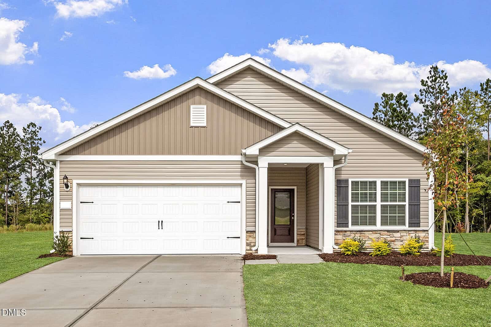 Charming single-story Oxford home at 107 Flue Court features tan siding, white trim, and a two-car garage. Enjoy a welcoming front porch with a white column and a neatly landscaped yard under a blue sky with scattered clouds.