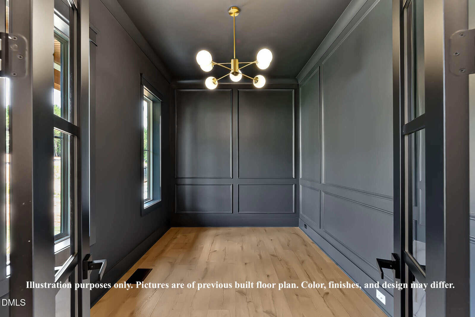 A modern, unfurnished room with dark gray paneled walls, light wood flooring, large windows, and a contemporary gold chandelier hanging from the ceiling. Text overlay at bottom notes image is for illustration purposes only.