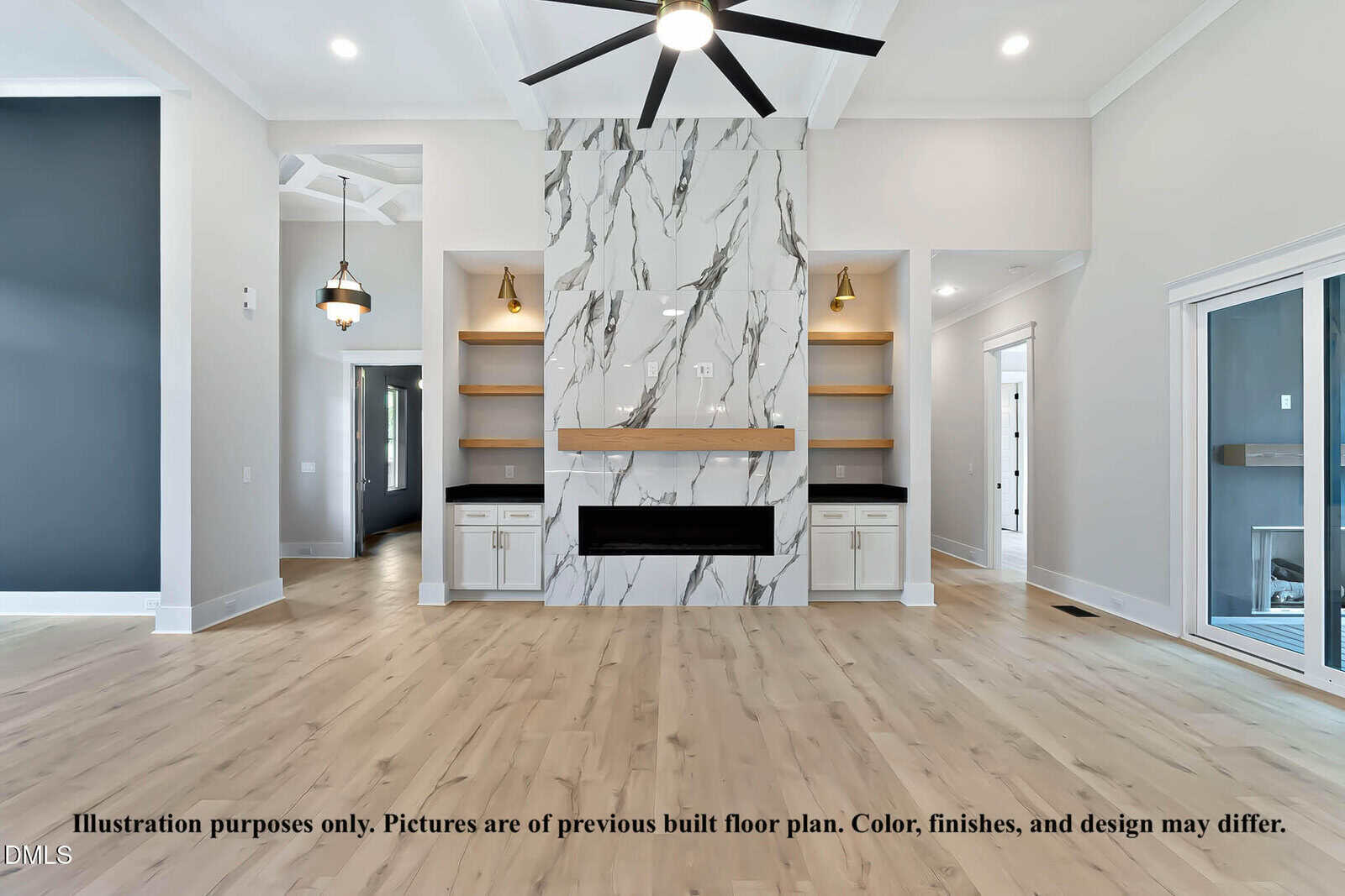 A modern living room with light wood floors, a striking floor-to-ceiling marble fireplace, open shelves on both sides, large windows, and contemporary lighting fixtures. Text at the bottom notes a design disclaimer.