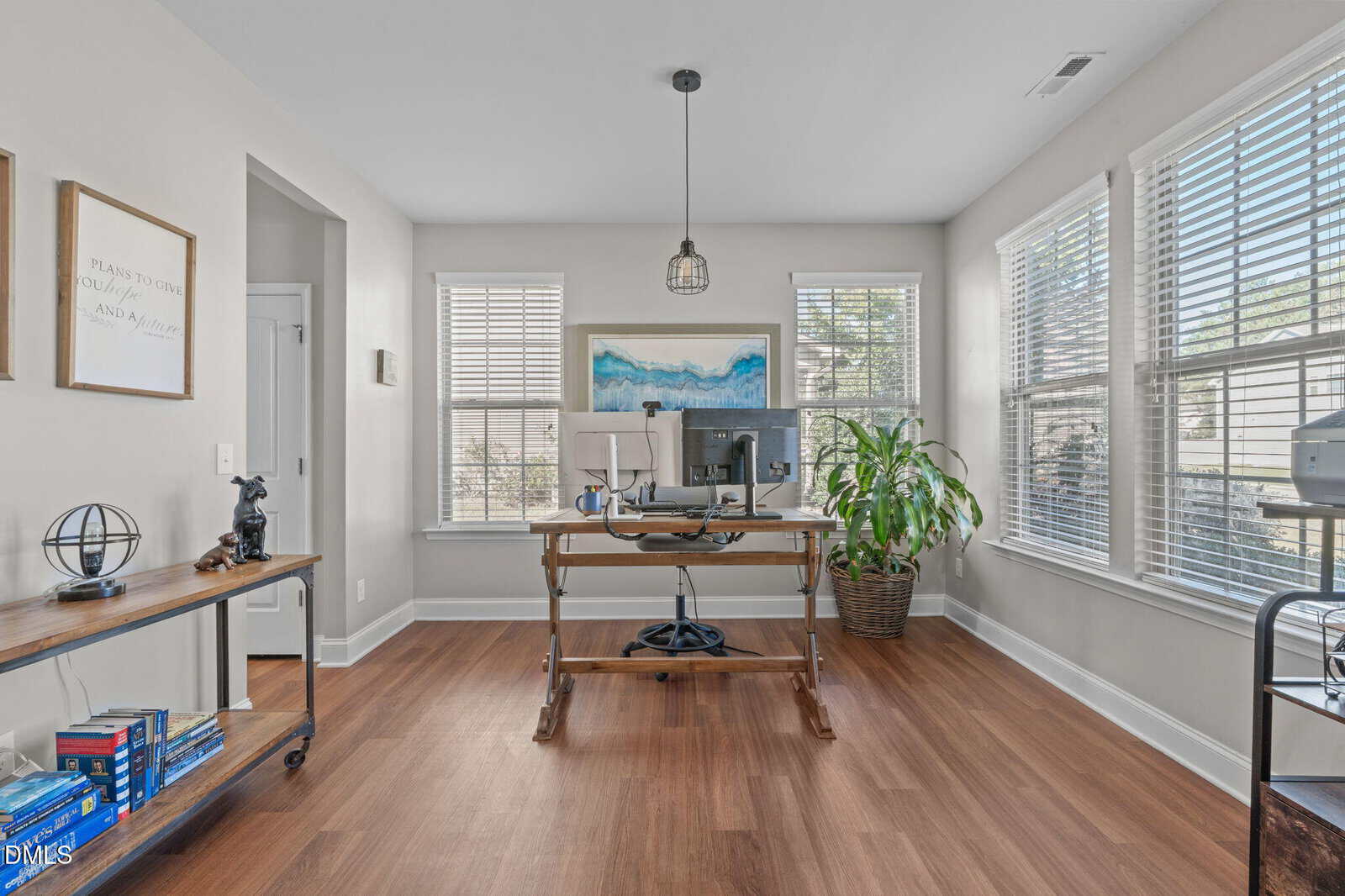 A room with a desk and a computer.