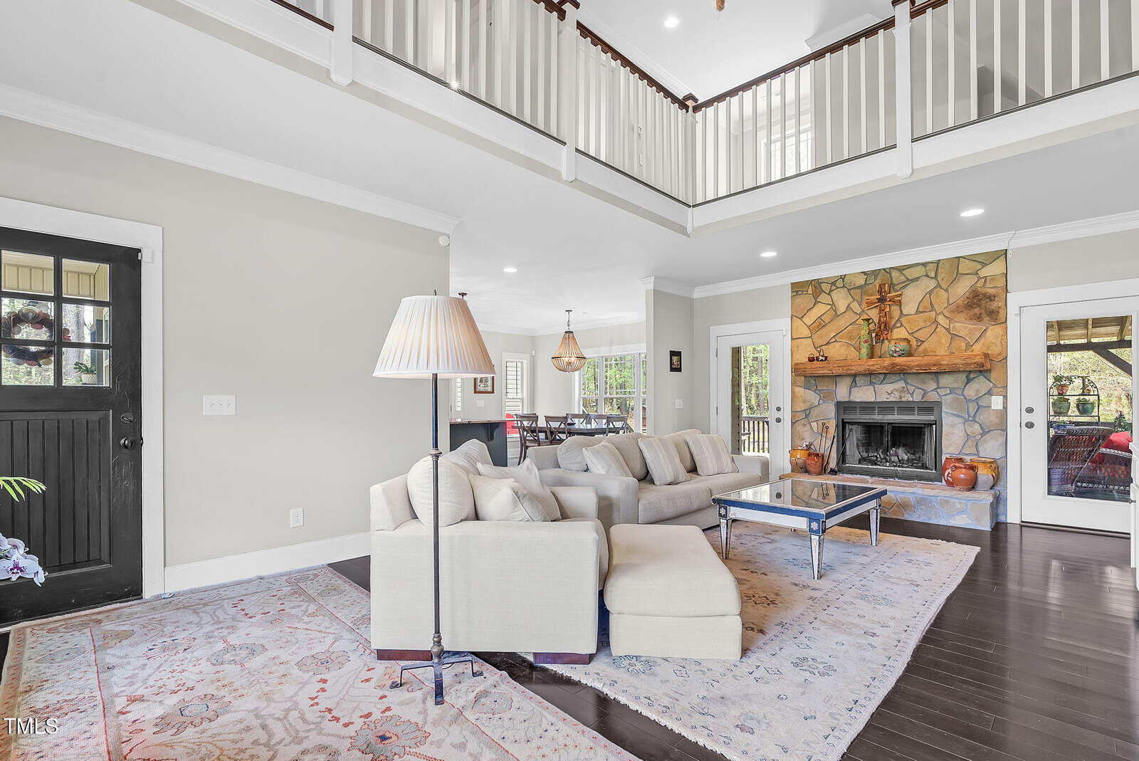 A living room with a fireplace and a couch.