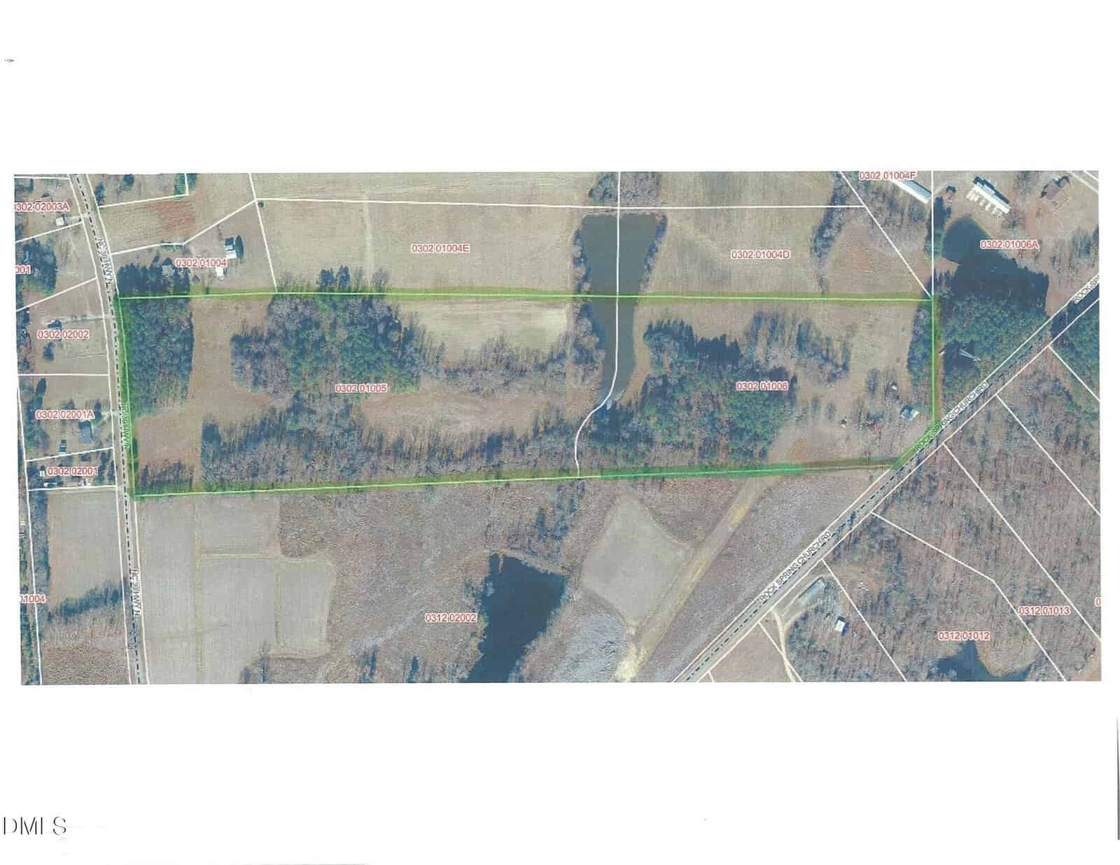 Aerial map showing a rectangular plot of rural land outlined in green at 790 Rock Spring Church Road, Henderson, with surrounding fields, roads, scattered trees, and property boundary numbers marked in red.