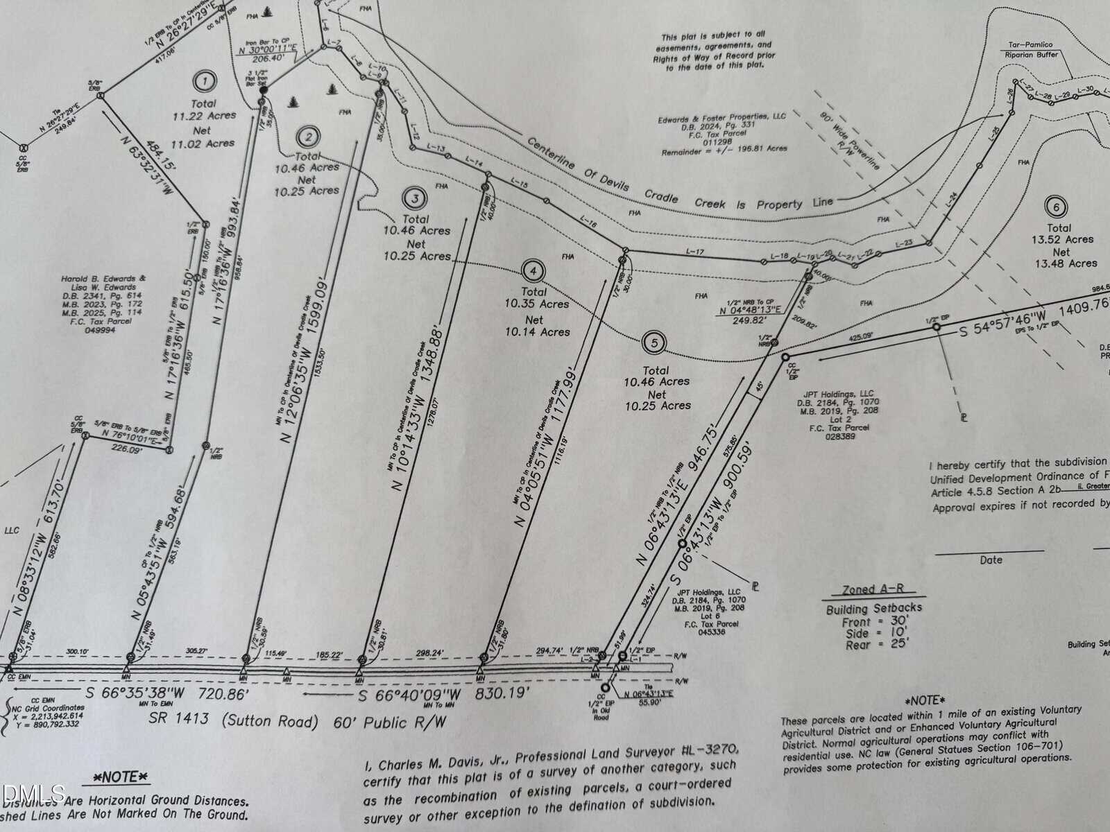A black-and-white survey map shows seven subdivided parcels of land, each labeled with acreage and measurements. Property lines, roads, and easements are marked with various notations and surveyor information.