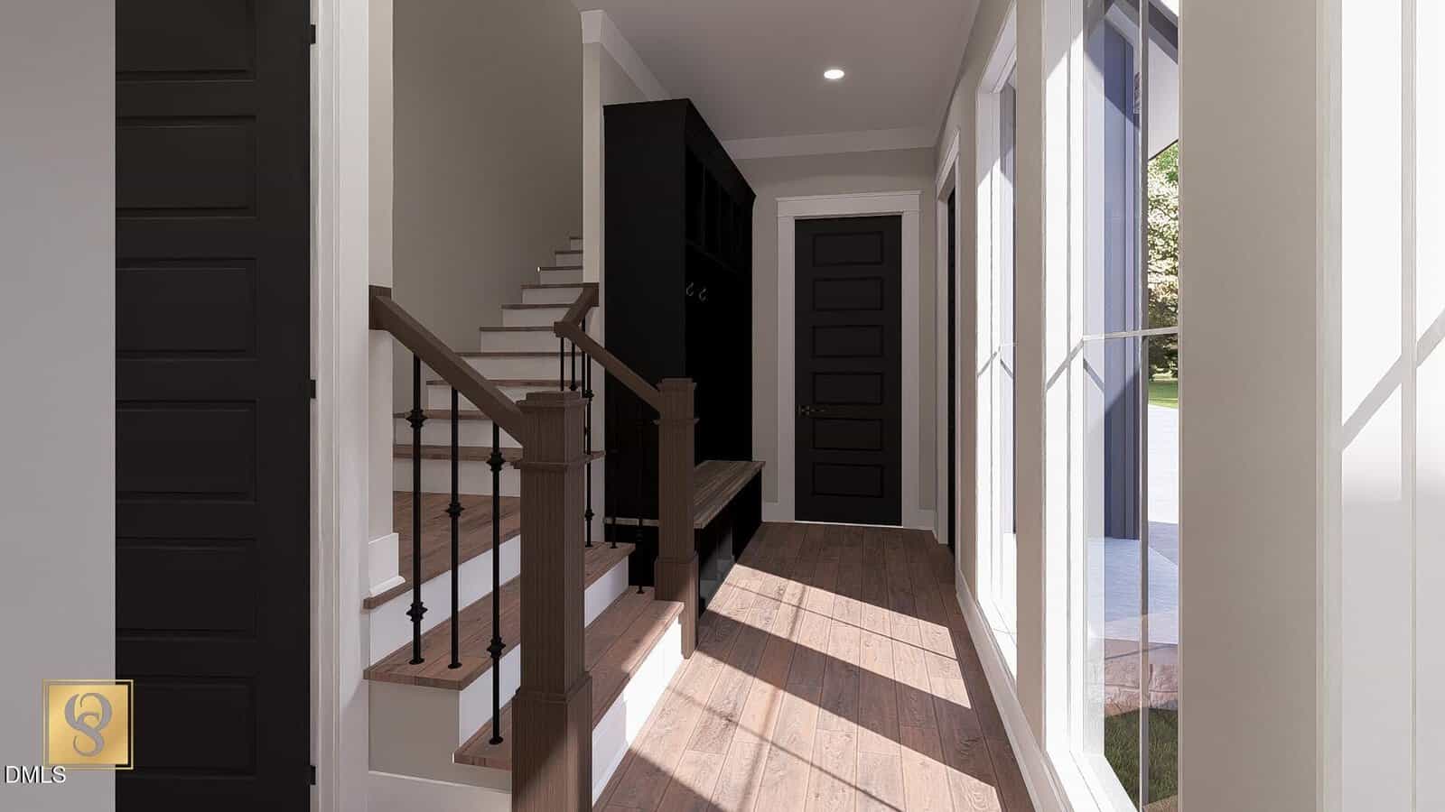 A sunlit hallway with large windows, dark door and trim, wooden flooring, a staircase with black railing, and a built-in bench with storage. Light filters in, illuminating the modern, clean design.
