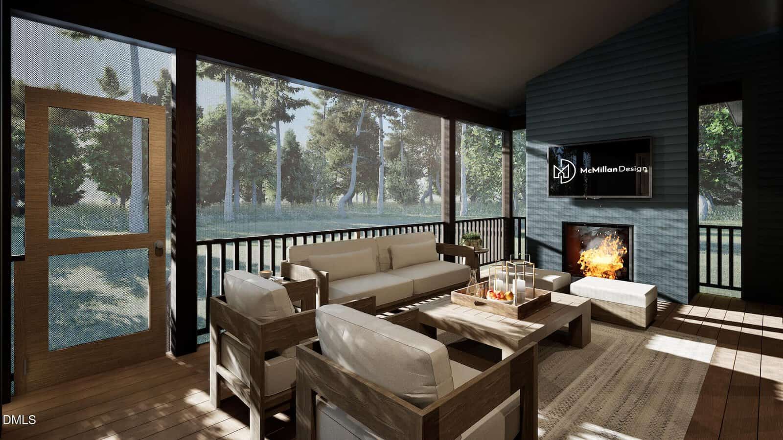 A screened porch with modern wooden furniture, a coffee table with candles, a wall-mounted TV displaying “McMillan Design,” and a fireplace. Large windows show trees and greenery outside. Sunlight enters from the left.