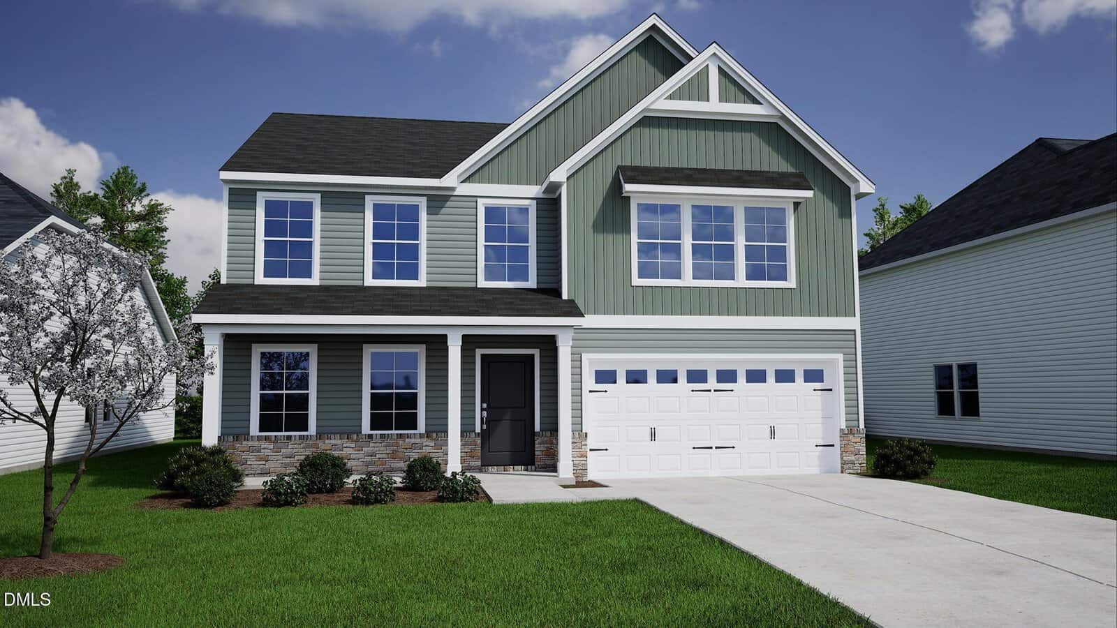 A two-story green suburban house with white trim, a double garage, and a stone accent along the front. The yard has green grass, bushes, and a small flowering tree, with neighboring homes on either side.