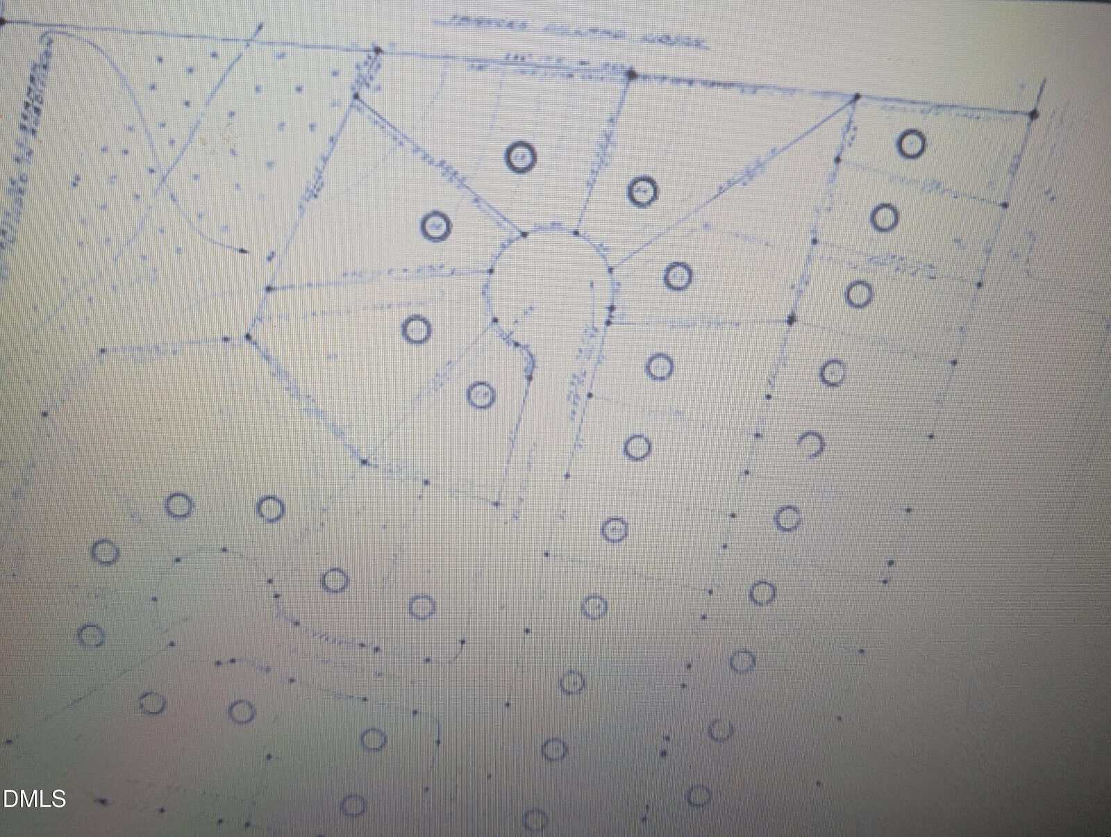 Faint blueprint-style image of the 27 Sagefield Dev in Henderson shows residential site plans with cul-de-sacs, rectangular lots, and circular symbols for trees or utilities. Dotted lines outline property boundaries.