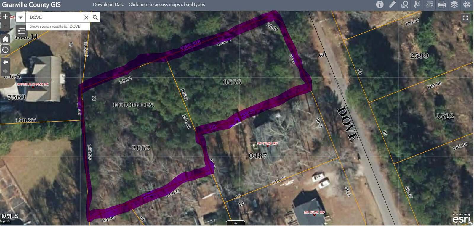A digital map shows a wooded property outlined in purple along 14 & 15 Dove Road near Oxford in Granville County. Surrounding lots, roads, and some houses are visible with parcel numbers and boundary lines clearly marked.