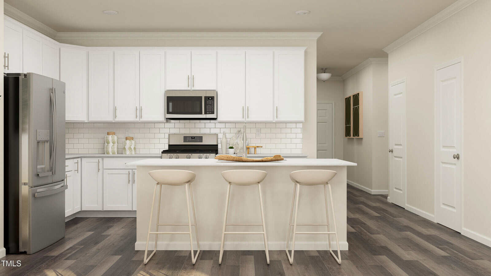 Modern kitchen with white cabinets, stainless steel appliances, a white subway tile backsplash, and a large island with three beige bar stools. Dark wood flooring contrasts with the light-colored decor.