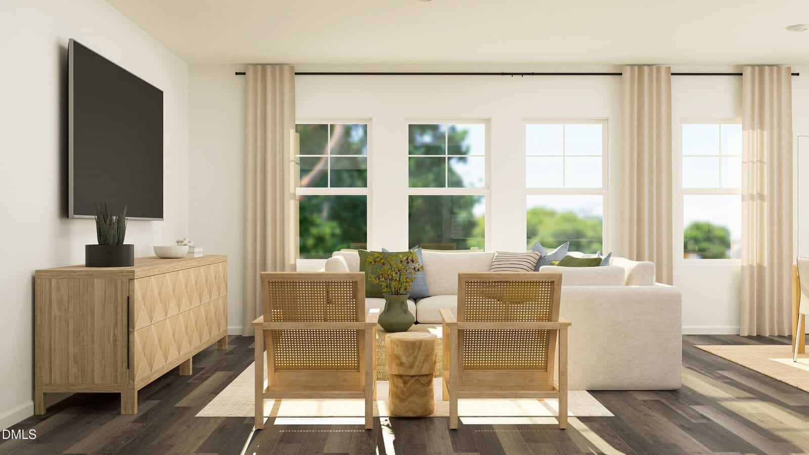 Bright living room with light wood furniture, large beige sofa, two rattan chairs, a wooden sideboard, and a wall-mounted TV. Three big windows let in natural light, highlighting neutral decor and a small potted plant.