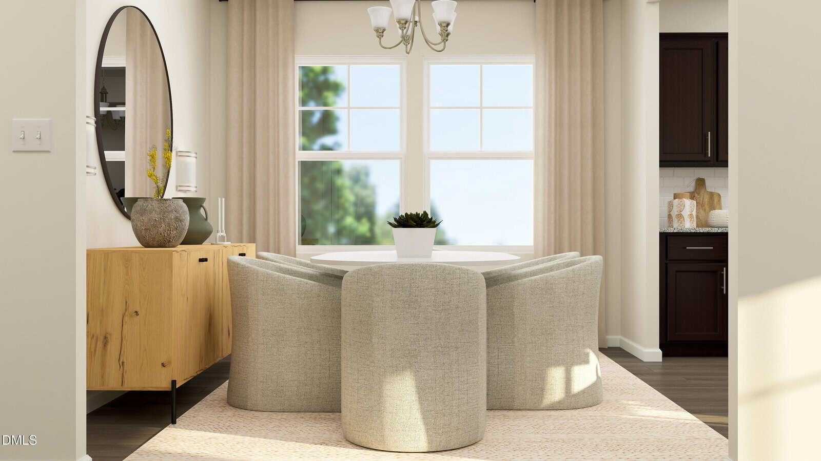 A modern dining room with a round table, four light gray curved chairs, a wooden sideboard, a large round mirror, beige curtains, and two windows letting in natural light.