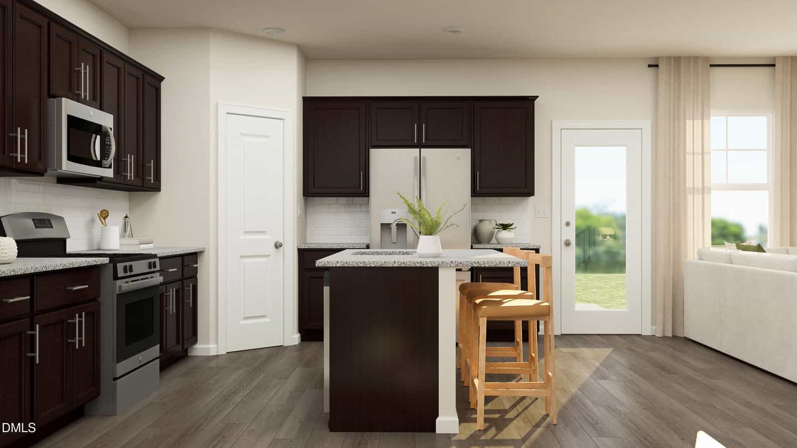 Modern kitchen with dark cabinets, a center island with two wooden stools, granite countertops, stainless steel appliances, and a plant on the island. A bright living area is visible through the open doorway and windows.