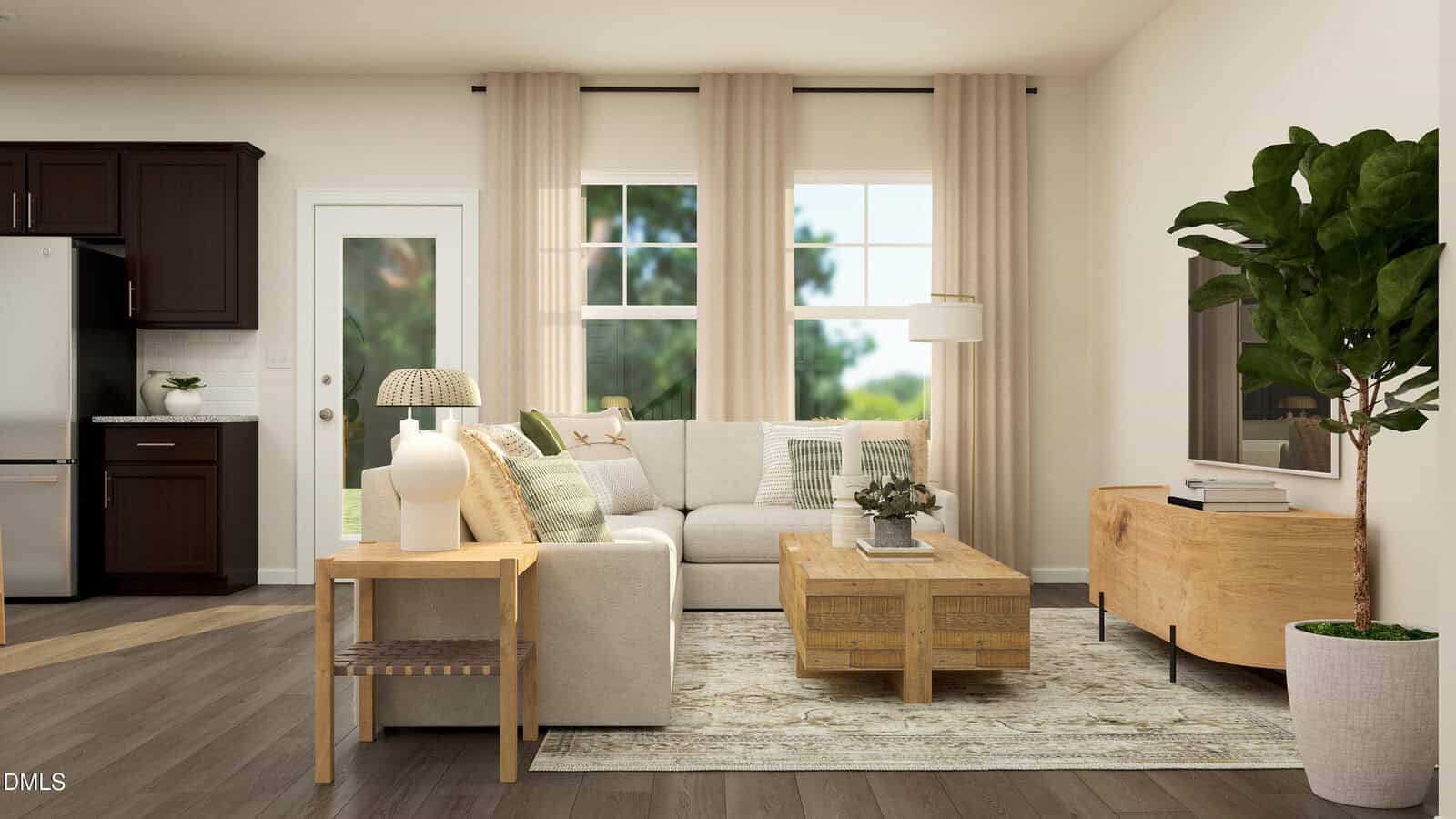 A modern living room with a beige sofa, wooden coffee table, side table with lamps, a large leafy plant, and beige curtains over tall windows, adjacent to a kitchen with dark cabinets and stainless steel appliances.
