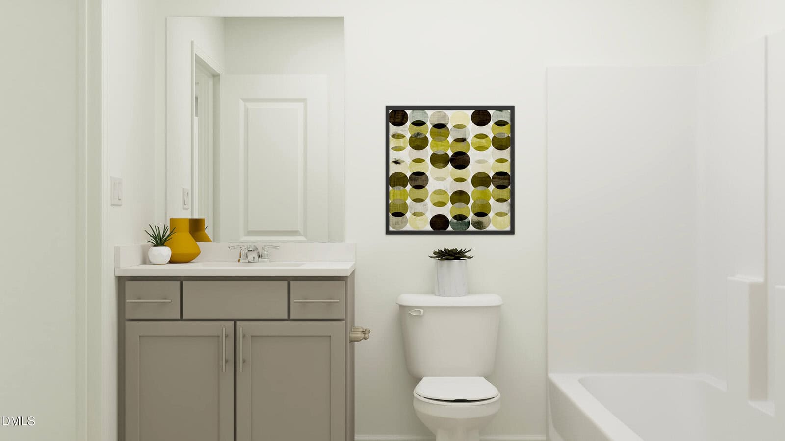 Modern bathroom with gray vanity, white countertop, potted plants, a white toilet, wall art with green and yellow circles, and a bathtub on the right. The space is bright with light walls and clean lines.
