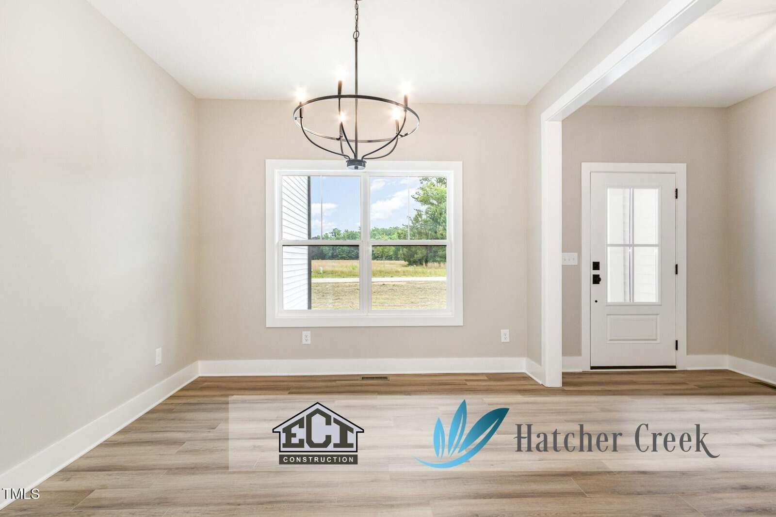 Bright, empty room with light wood flooring, a large window, a modern black chandelier, and a white door. "ECT Construction" and "Hatcher Creek" logos appear at the bottom.
