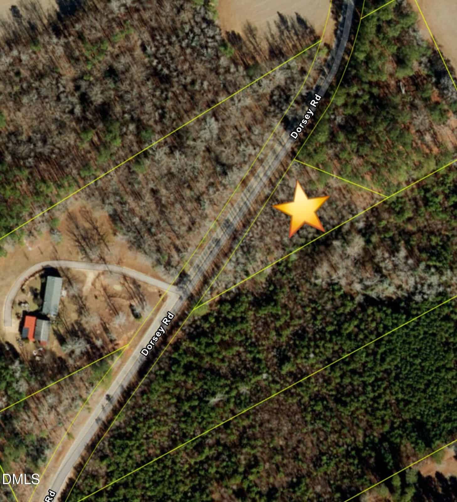 A satellite map view shows Dorsey Road curving through a wooded area. Yellow property lines are visible, a house sits on the left, and a large yellow star marks a spot to the right of the road.
