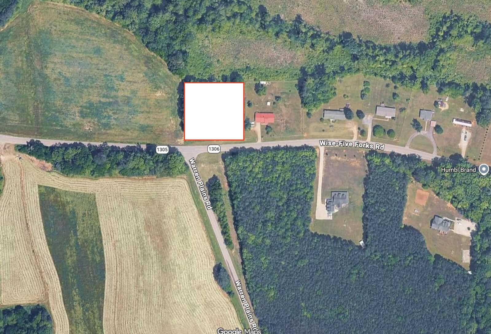 Aerial view of 475 Wise Side Forks Road, Warrenton, with scattered houses, fields, and trees. A white square covers a section near the road’s intersection with Wise Alston Road.