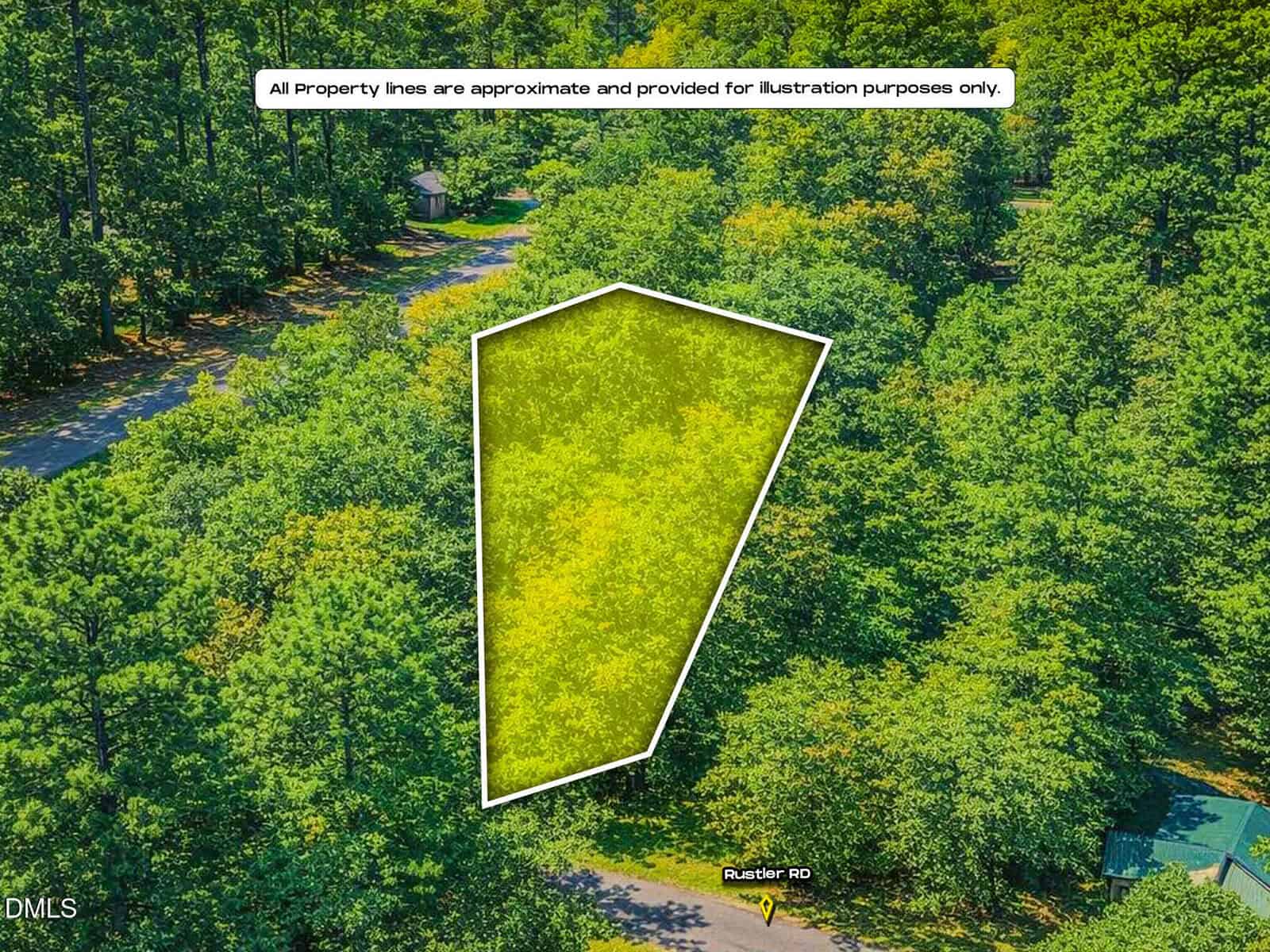 Aerial view of a wooded lot outlined in white and shaded yellow, showing approximate property boundaries near a road labeled “Rustic Dr.” Surrounding area is dense with green trees.