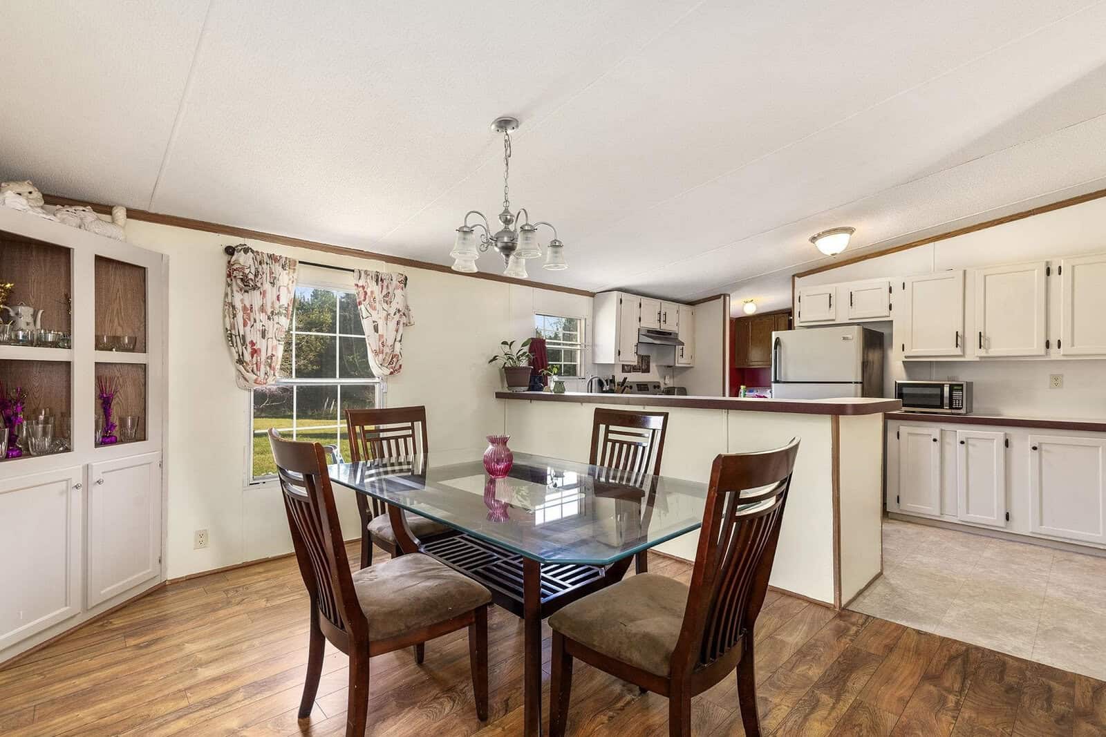 A dining table and chairs in a house.