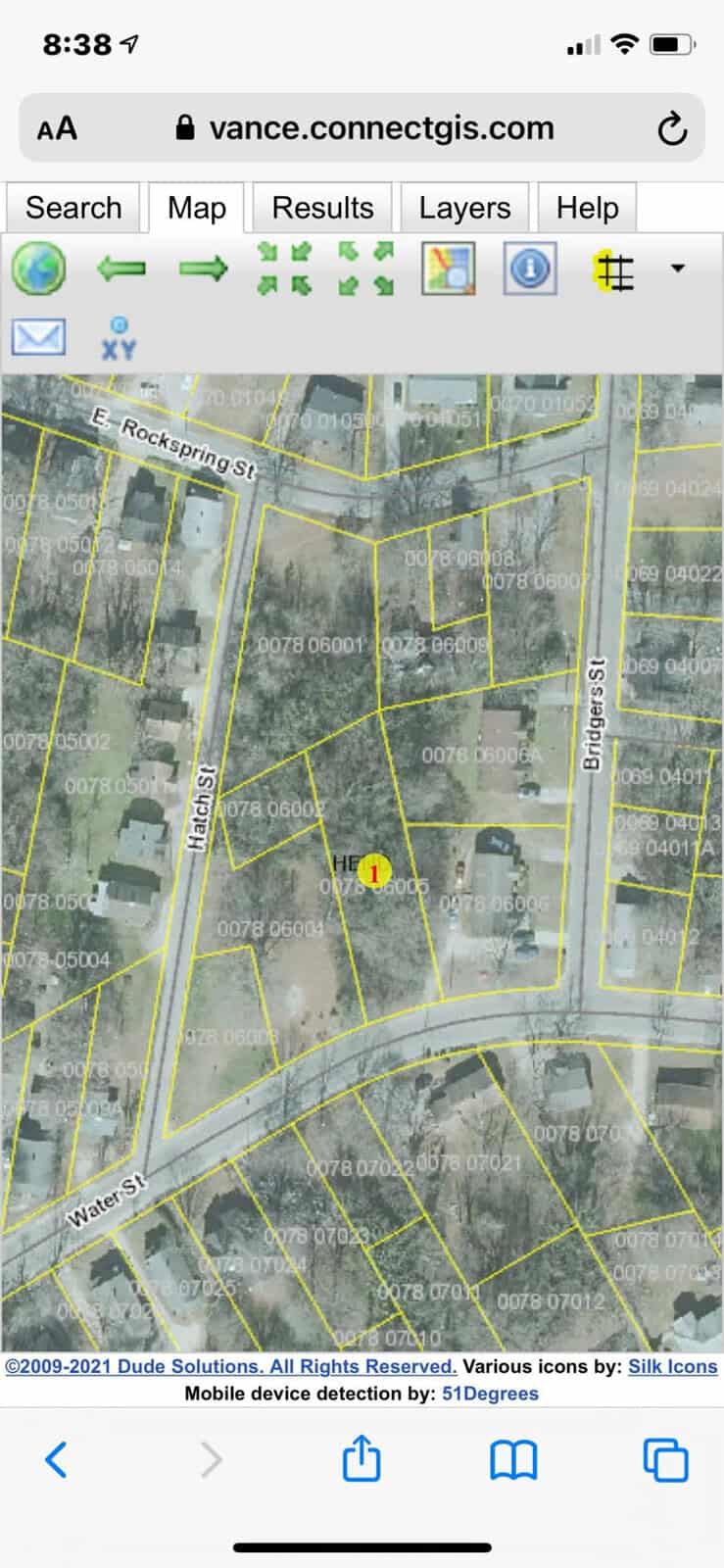 A screenshot of a mobile device displaying a map with street layouts and a marked location, attribution to map data sources and icon credits are visible at the bottom.