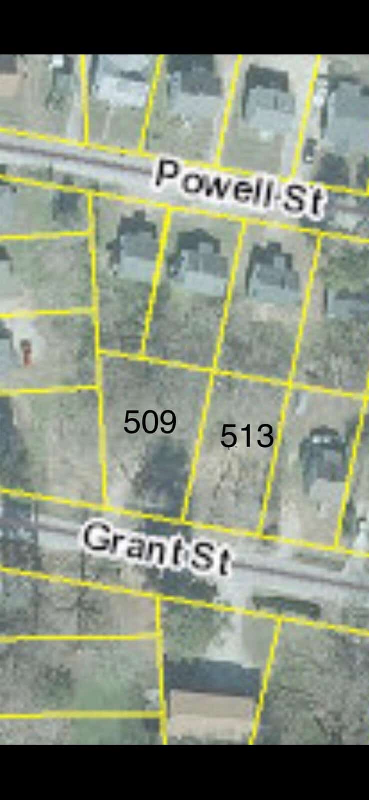 Aerial view of a map segment showing the intersection of powell st. and grant st. with property lines and numbers.