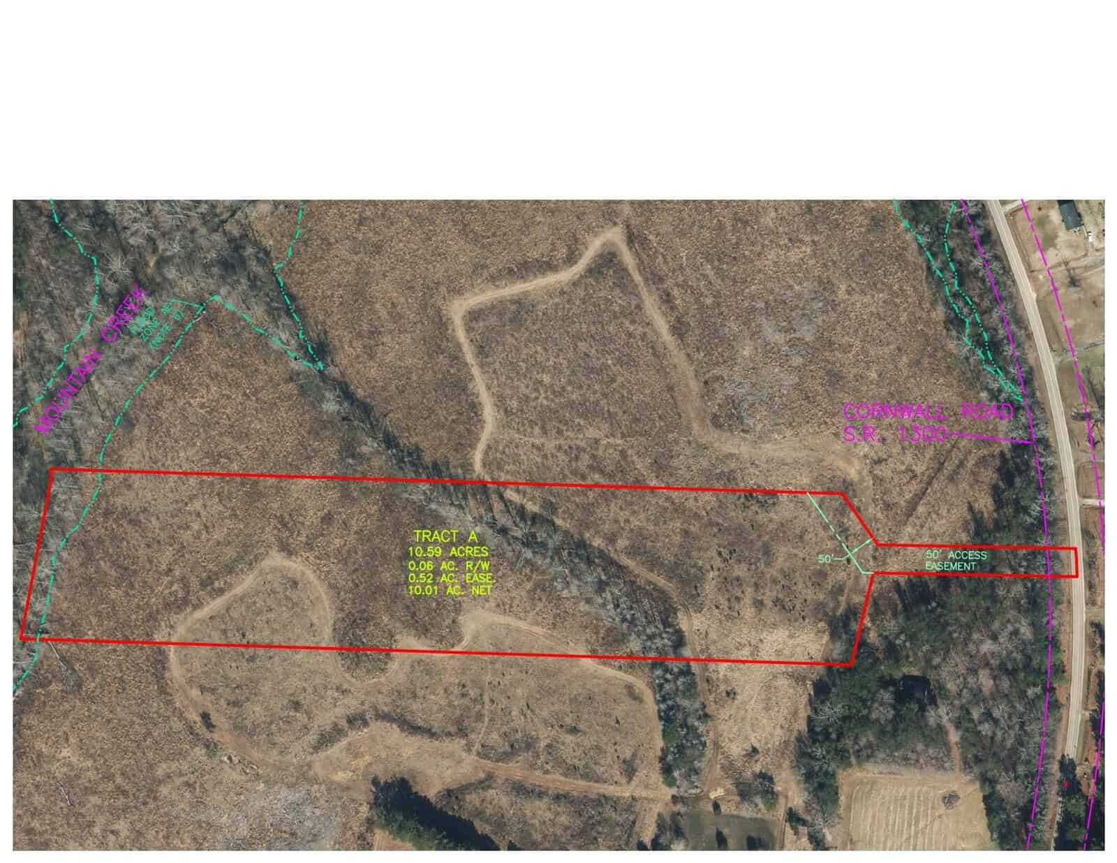 Aerial view of a rectangular piece of land outlined in red, labeled "Tract A: 10.96 acres" near 7711 Cornwall Road, Oxford. The surrounding area includes sparse vegetation and a road on the right. A turquoise-marked creek meanders along the left side of the image.