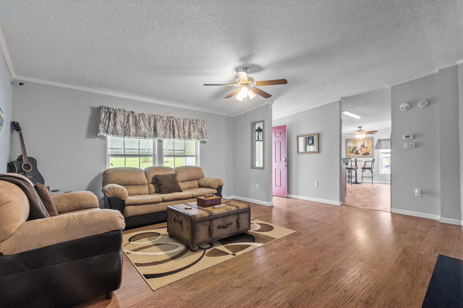 A living room with a couch and a coffee table.