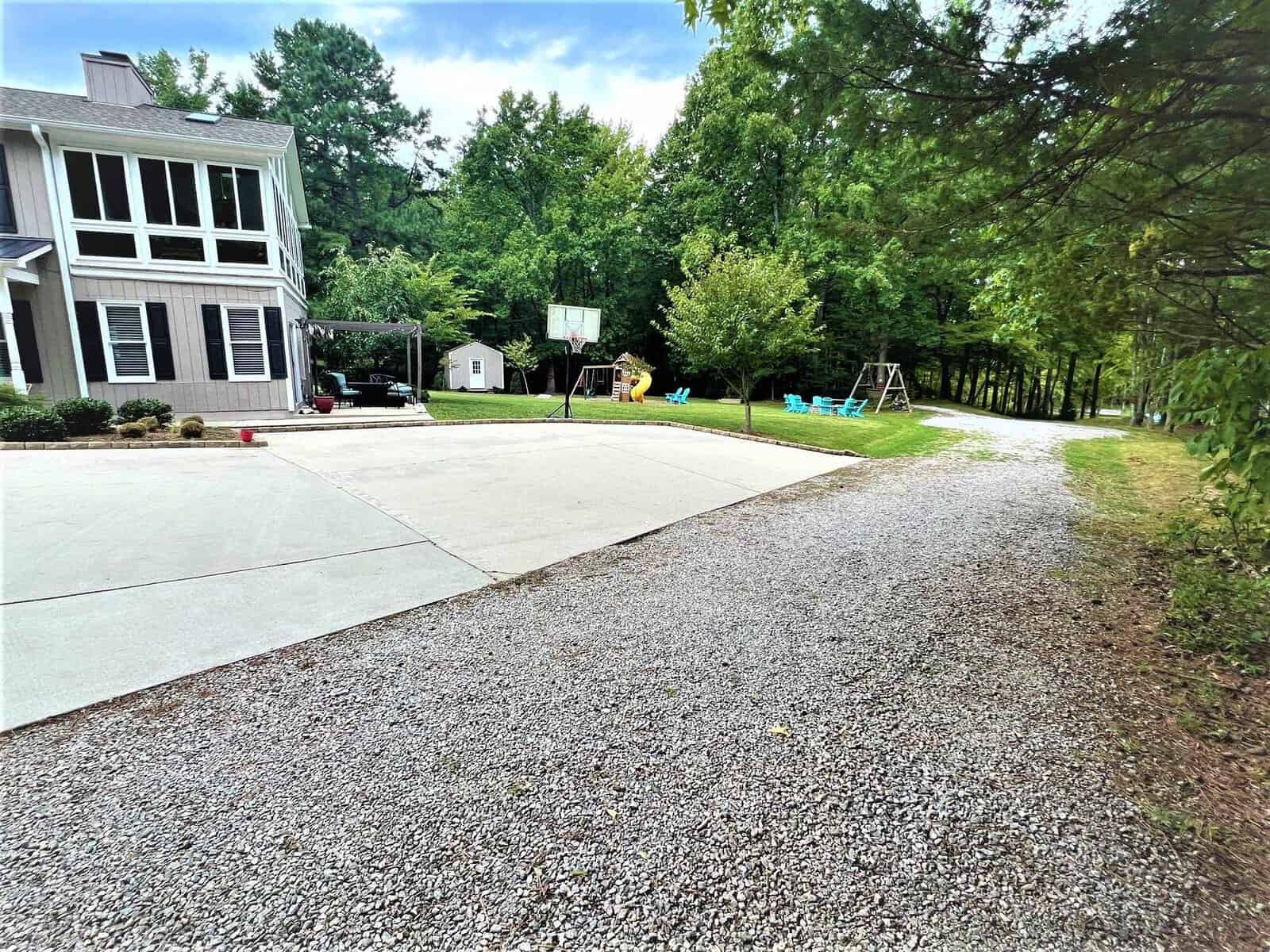 A house with trees on a driveway in Henderson NC.